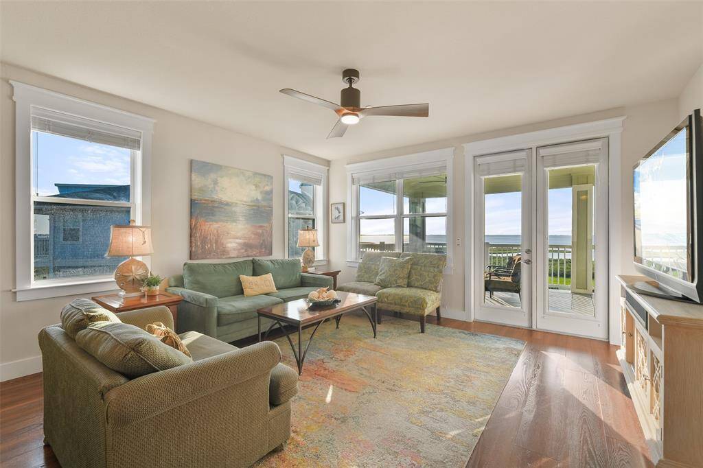 Now we come to the living area, which is surrounded by walls of windows