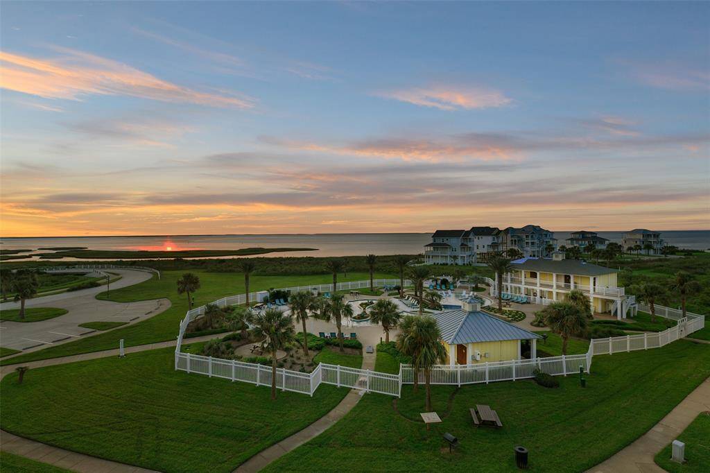 This coveted location enjoys views upon views...over-looking the lazy river with an endless Bay vista.