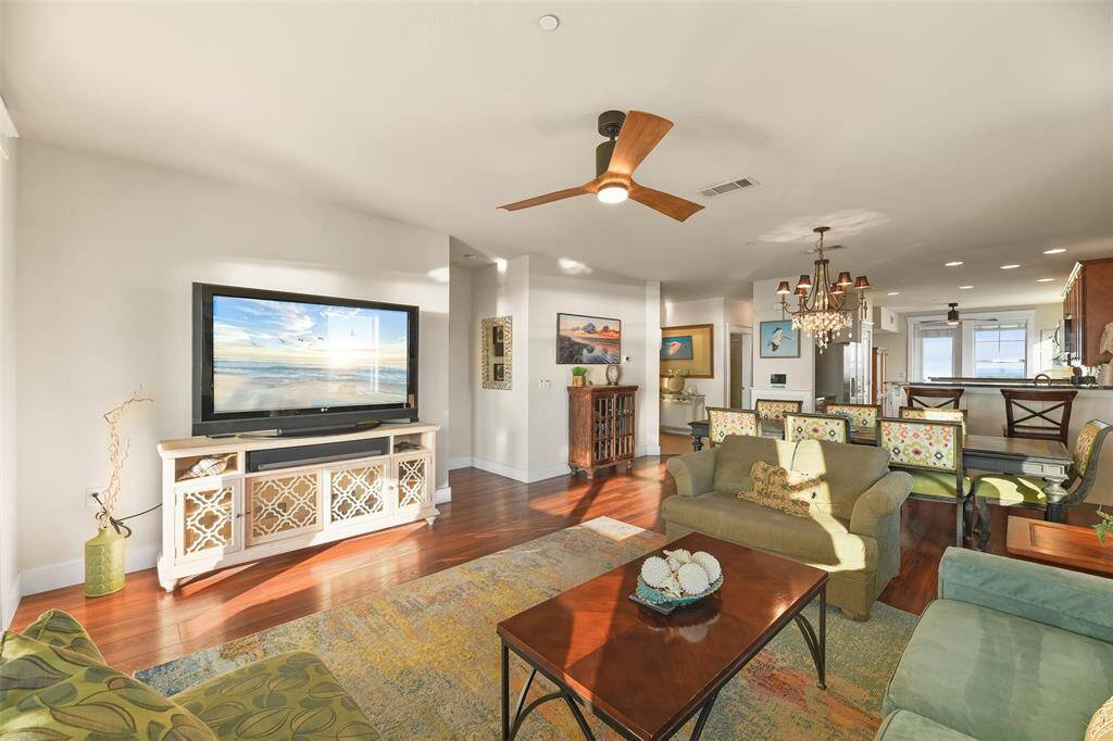 This view from the living area shows just why this floorplan is the most-coveted here at Pointe West! These condos were designed with larger and extended families in mind. From the living area, we have the dining area, proceeded by the central kitchen offering dual breakfast bars and an additional family room on the other side with it's own balcony. All of this being on the top floor for the BEST views imaginable.