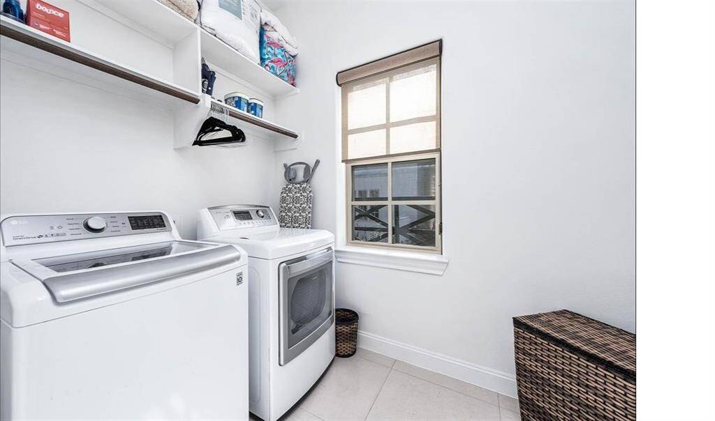 Featuring a convenient utility room off the second floor with a dedicated hanger area and overhead cabinets, making your weekly laundry routine a breeze.