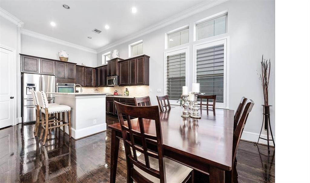 Take a look at this stunning kitchen, featuring modern finishes, ample counter space, and a layout perfect for both cooking and entertaining.