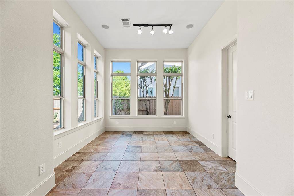 ChatGPT said:Enjoy a sunlit sitting area just off the kitchen, designed to capture natural light and warmth—an inviting space perfect for morning coffee or relaxed conversation in a setting of quiet luxury.