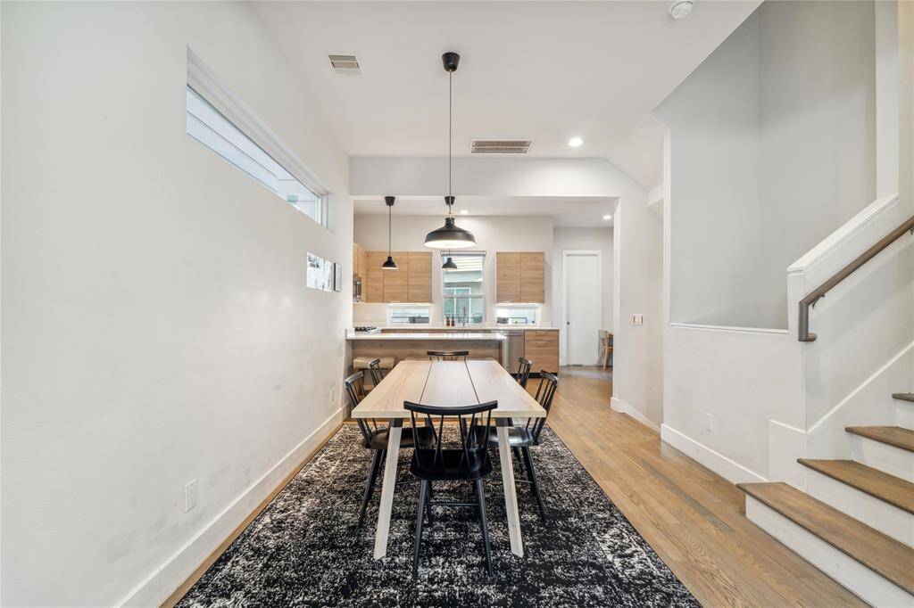 The dining area seamlessly flows into the kitchen, creating an open and inviting space perfect for both everyday meals and entertaining.