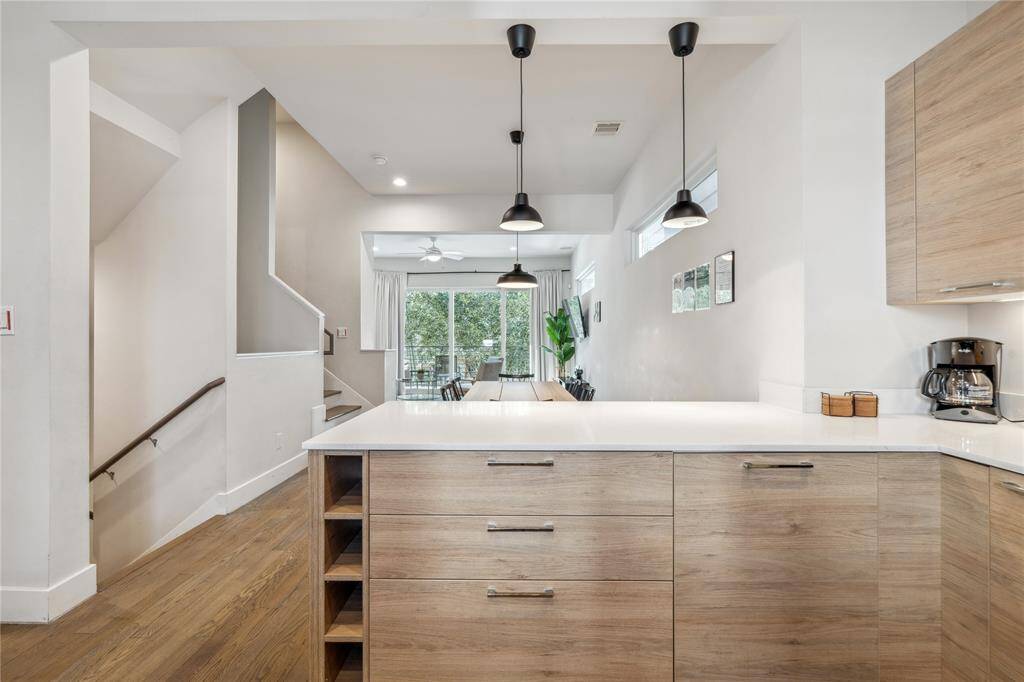 Designed with clean lines and a sleek aesthetic, the flat-panel or shaker-style cabinets create a sophisticated yet timeless look.