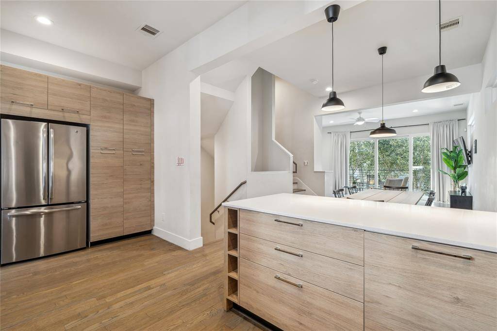The kitchen cabinets in this home are a perfect blend of modern style and practical storage.