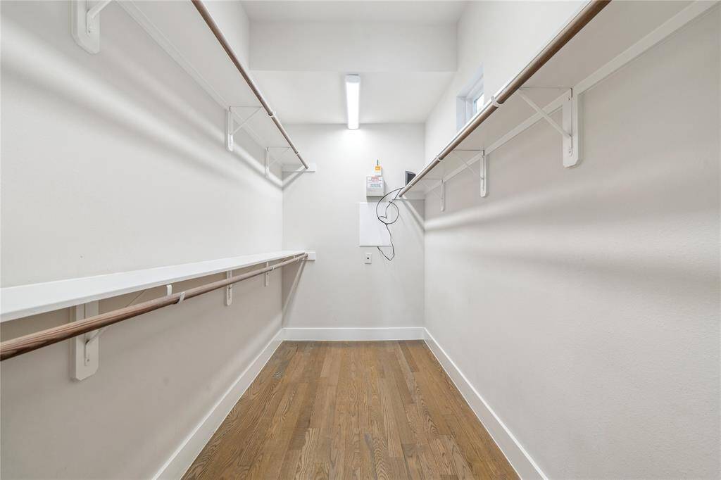 A large walk-in closet provides ample storage space.