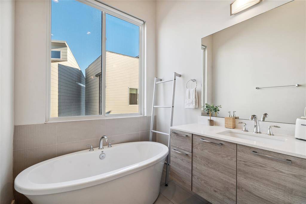 Whether waking up to natural light or unwinding after a long day, the primary bathroom serves as a true retreat within the home.