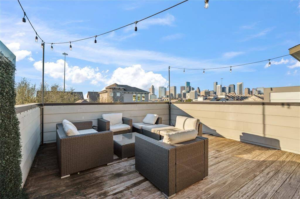 The rooftop terrace is a stunning outdoor retreat, offering unobstructed views of the city skyline or surrounding neighborhood.
