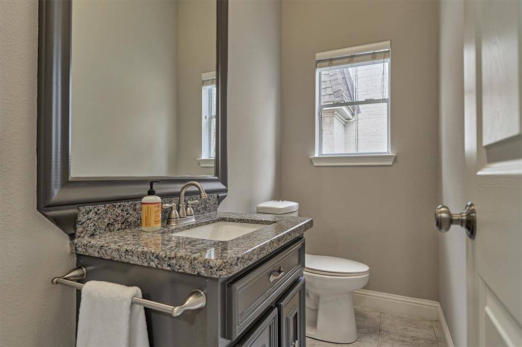 The half bath located just off the main living area offers convenient access for guests.