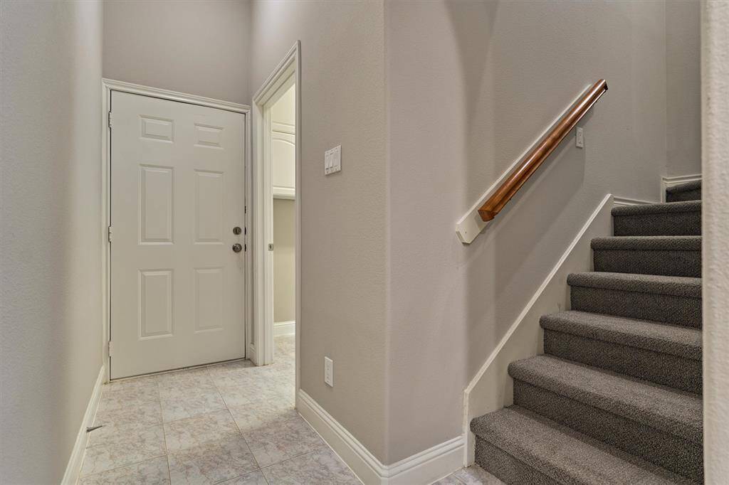 A back stairway near the garage adds convenience and offers easy access to the laundry room.