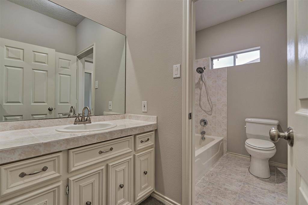 This view of the bath area reveals the second sink, conveniently accessible from the second-floor hallway, making it ideal for shared use while maintaining privacy for each bedroom.
