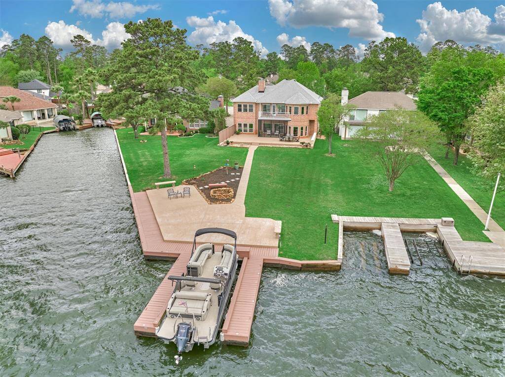 Enjoy a private boat slip with surrounding decking and a cozy fire pit area—both ideal spots for relaxing and taking in peaceful evenings by the water.