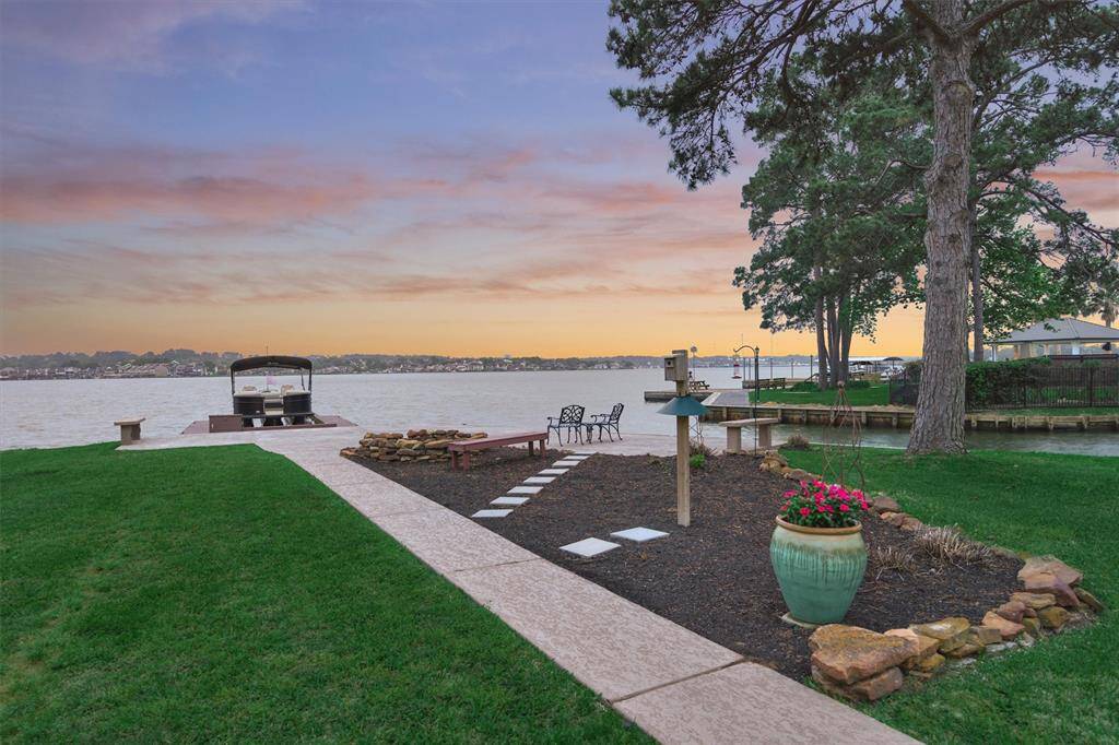 A closer look at the sidewalk reveals a nicely landscaped area for your favorite plants and bird feeders.