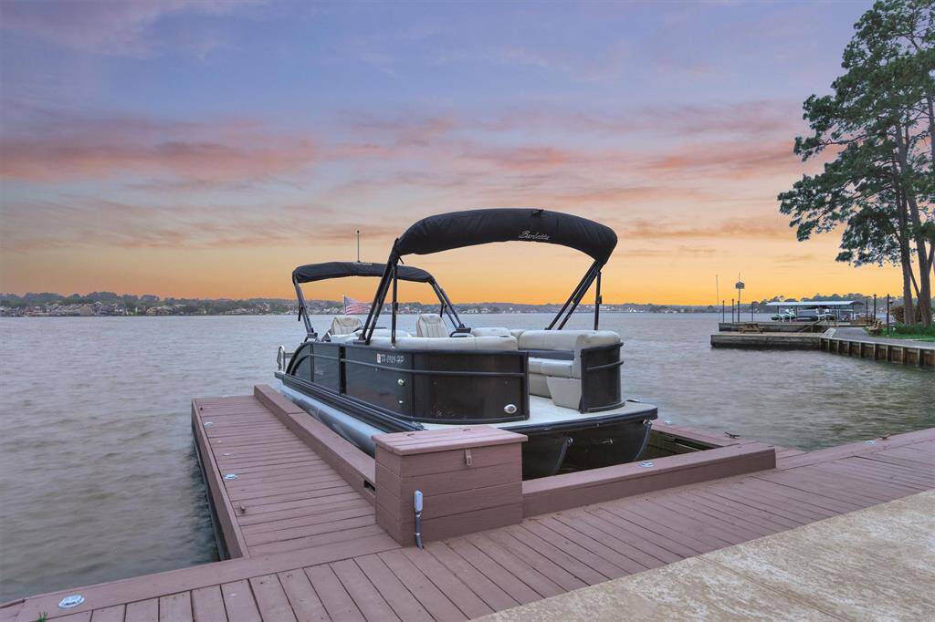 Your private boat slip has a NEW boat lift and motor and is surrounded by DEEP WATER, providing easy access for boating year-round. Additional newly installed decking offers ample space for fishing, lounging, and lakeside recreation.