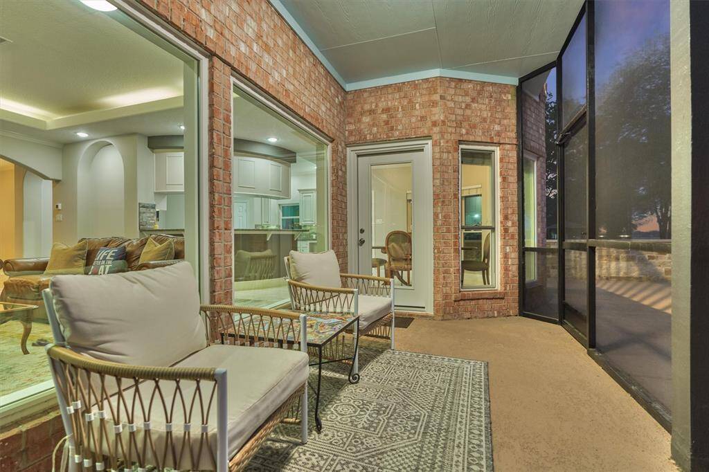 The screened-in porch is conveniently accessed through a door off the breakfast area and also opens to the back patio, making it easy to enjoy the outdoors from multiple areas.