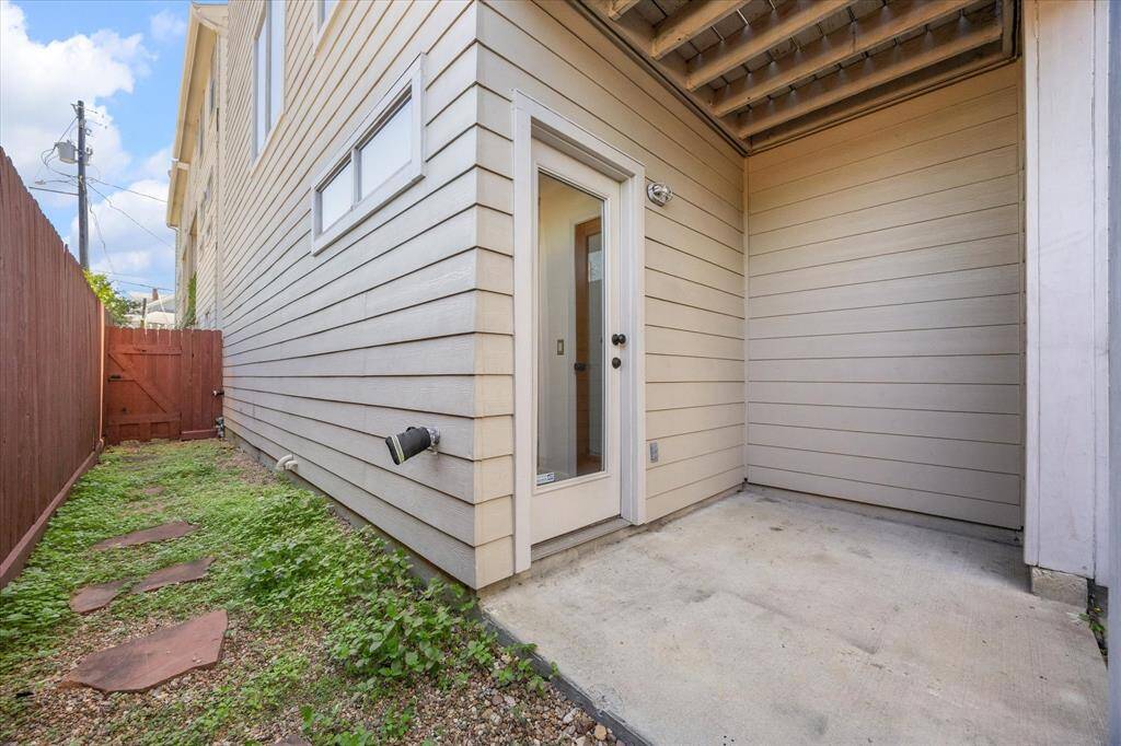 A private, covered ground floor patio and small fenced yard are ready for your personal touches.