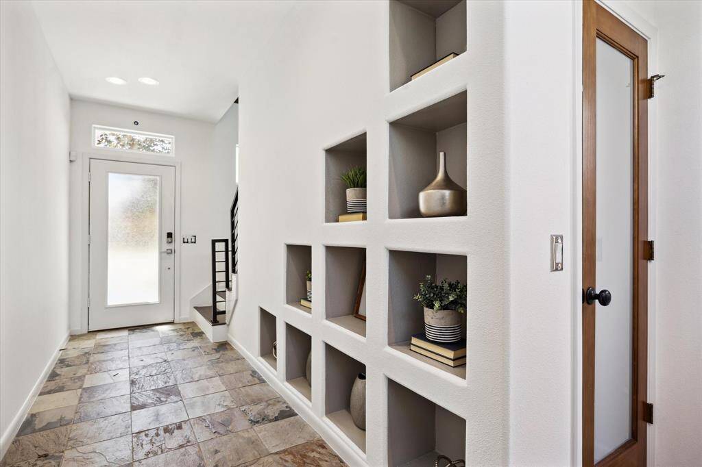 Smart design meets modern living in this stylish three-story home. The ground floor offers direct access to the garage and a small private fenced yard with a covered patio, perfect for entertaining or just unwinding. Head up to the main floor where the open layout connects the kitchen, dining, study nook, and family room ideal for effortless everyday living. On the top floor, two private suites await, including a luxe owner’s retreat built for rest and relaxation.