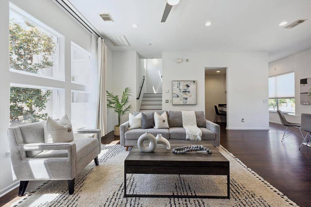 With an effortless flow into the dining area and kitchen, this sun-drenched family room is thoughtfully designed for comfortable everyday living. Whether you're hosting lively gatherings or savoring quiet mornings, the open-concept layout and abundant natural light set the perfect tone making every moment feel special.