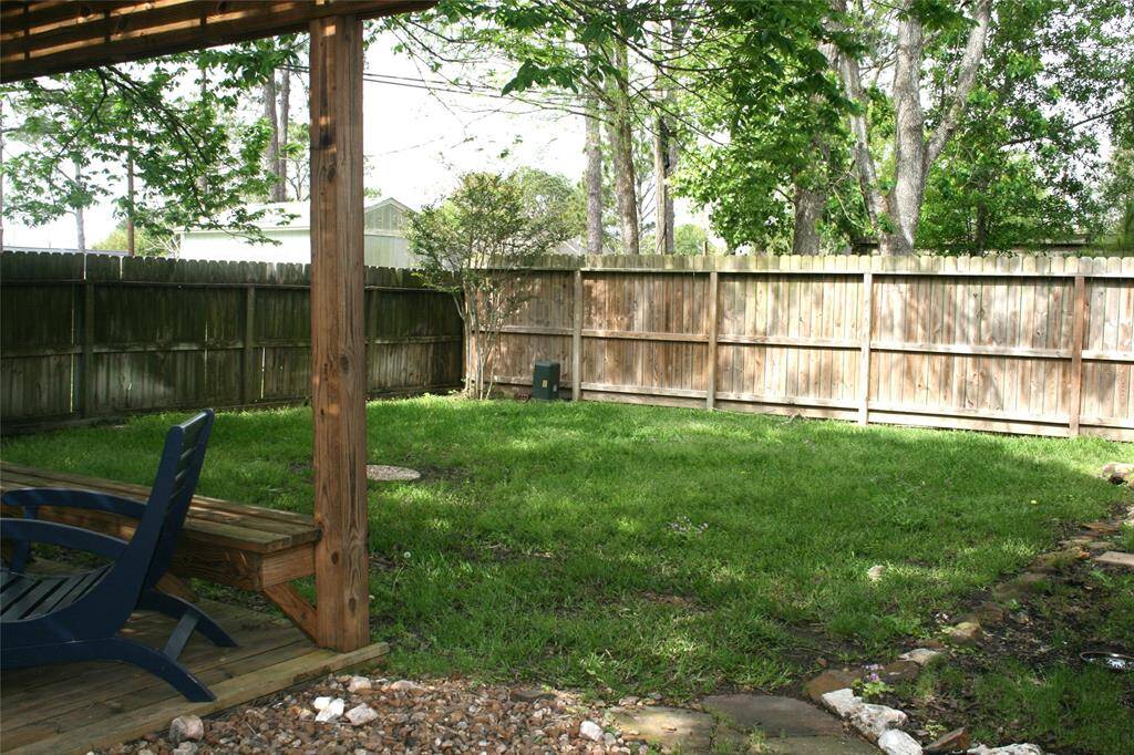 Backyard with beautiful landscaping.