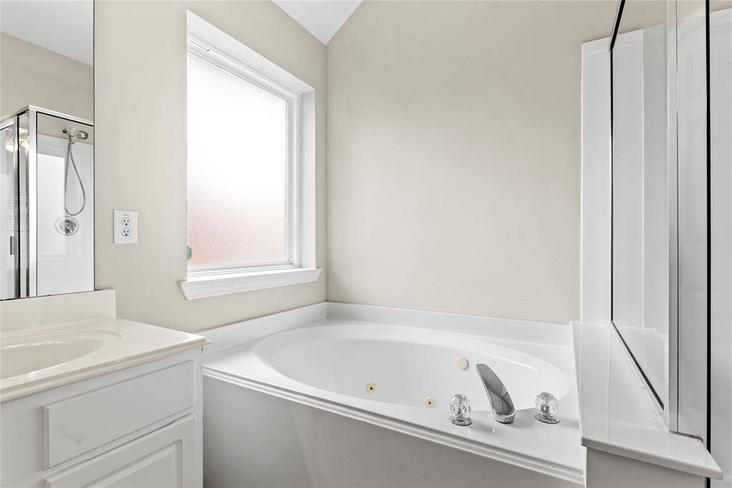 The soaking jetted tub is a perfect space to sink in and relax.