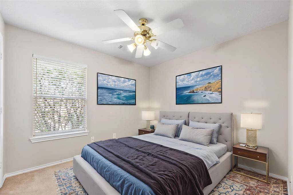 Your second bedroom offers a generous and inviting space that exudes comfort and versatility. - virtually staged