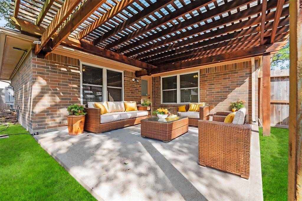 The extended covered patio is an easy place to sit back and watch the sunset or just get some you time in the fresh air.  - virtually staged