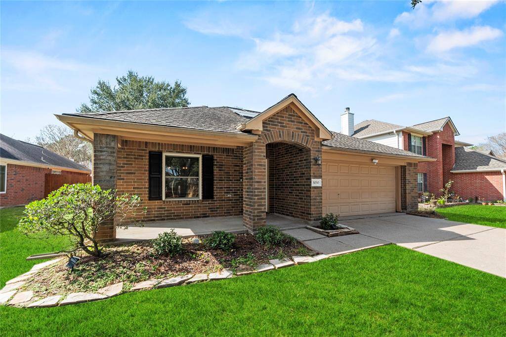 The charming brick-front porch provides the perfect spot to relax and unwind, offering a peaceful place to sit and take in the sights and sounds of the neighborhood.