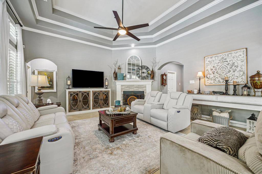 TRAYED CEILING AND CORNER FIREPLACE IN FAMILY ROOM