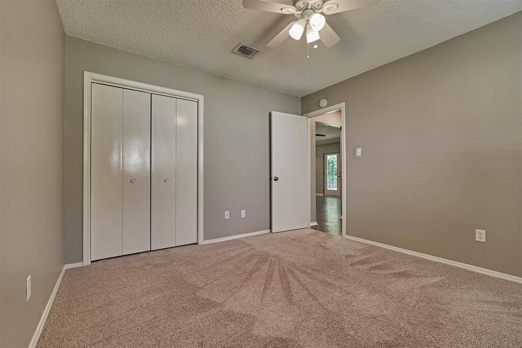Bedroom 2 with bifold closet doors to save space