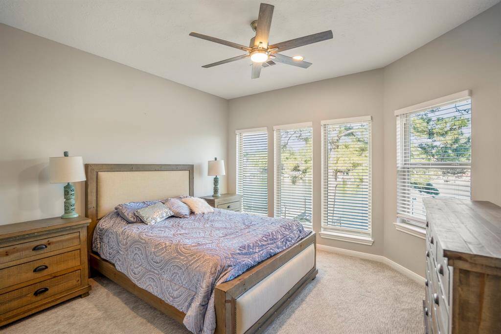 This huge bedroom is upstairs and has lots of windows that stream in light and offers great views.