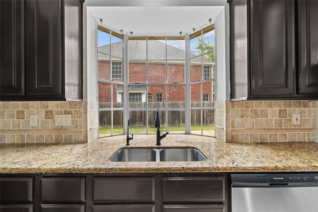 Kitchen with view of second stair case