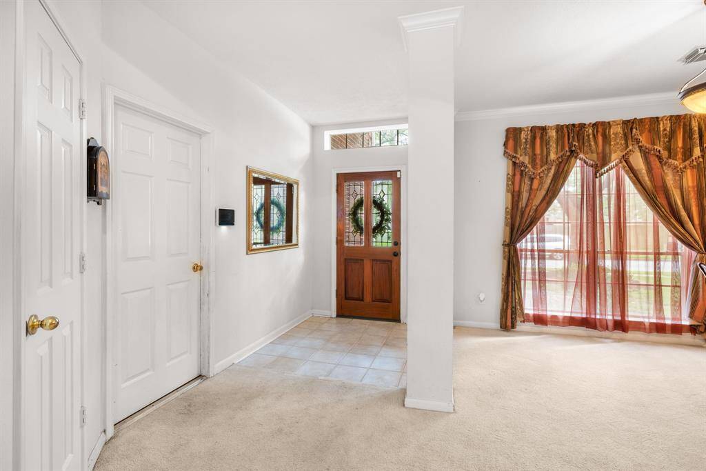 ENTRY - The doorway on the left leads to the converted garage space.  Other door is an entry closet.