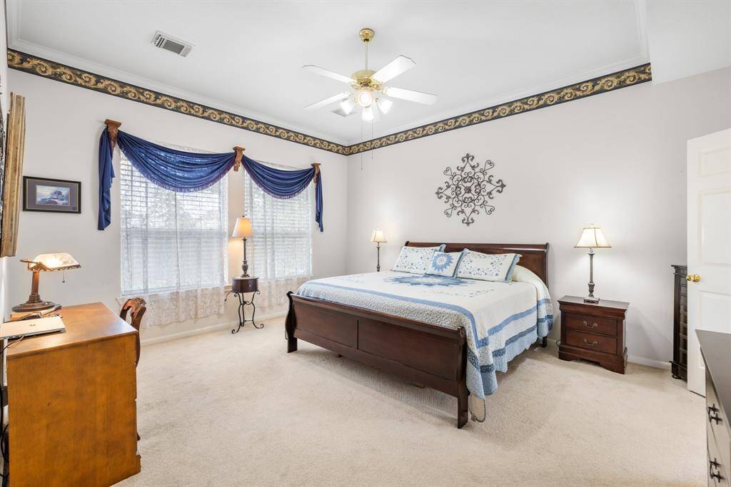 PRIMARY BEDROOM - Spacious room faces the back of the home.