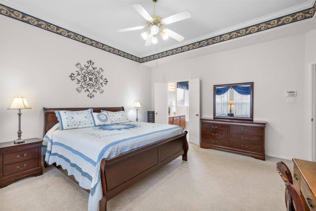PRIMARY BEDROOM - Spacious room with ceiling fan.