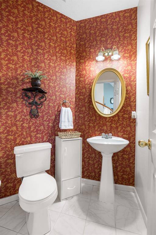 POWDER ROOM - Half-bath located downstairs.