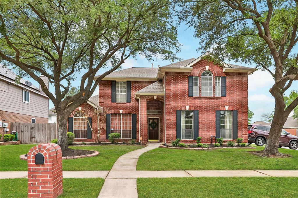 Beautiful mature trees have been nicely maintained. Flower beds and landscaping in place.