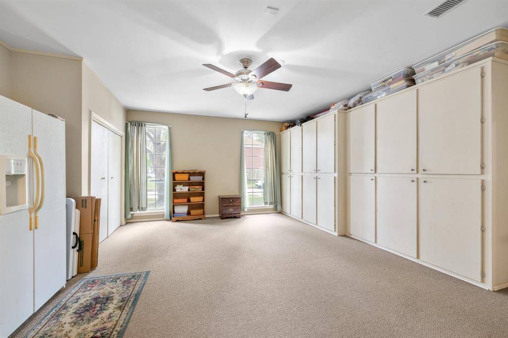EXTRA ROOM - The garage has been converted to living space, complete with heat and A/C.  There is a closet and built-in storage cabinets.  This room could be used as a game room, playroom, bedroom, home-office, homeschool room, craft room, or whatever you need it to be.