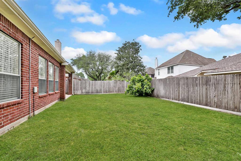 BACK YARD - Plenty of room for kids and pets to play.