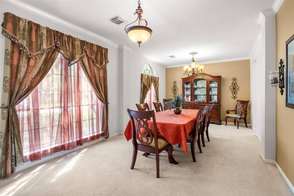 LIVING & DINING ROOMS - These rooms could be used separately for a living space and dining room or could be combined as one large dining area as the owners have done.