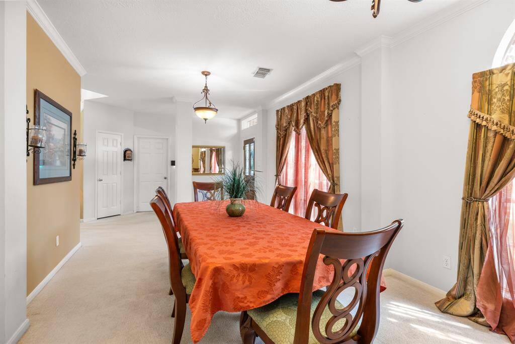 LIVING & DINING ROOMS - Opens to kitchen for easy serving and entertaining.