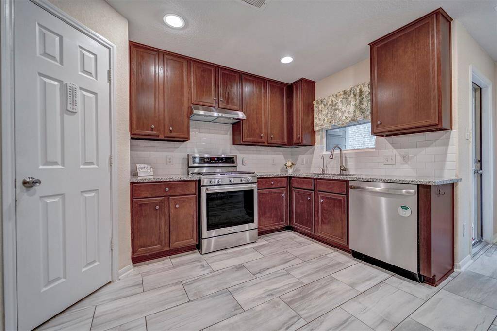 There's ample lighting and storage space, creating a warm and functional cooking area.