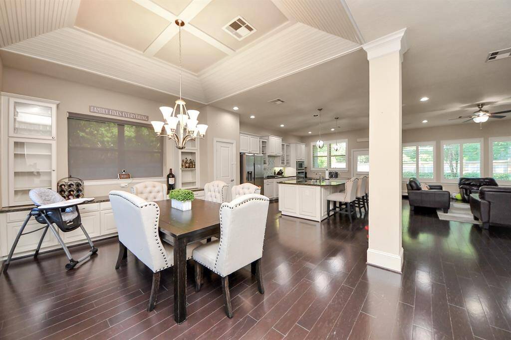 DINING AREA WITH CUSTOM BREAKFAST BAR AREA AND STORAGE AREA