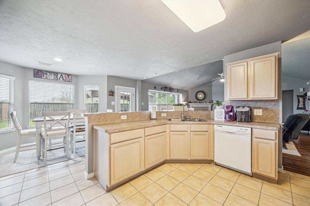 Open kitchen area with backyard views.