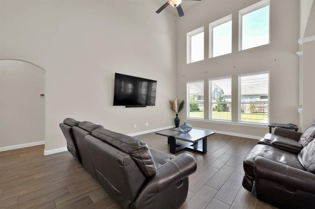 This large 17 x 15 living area is perfectly setup to accommodate a large entertainment area. Before we run off to view the primary bedroom, let's make note that the floor outlets make it convenient for lamps, furniture, or electronics.