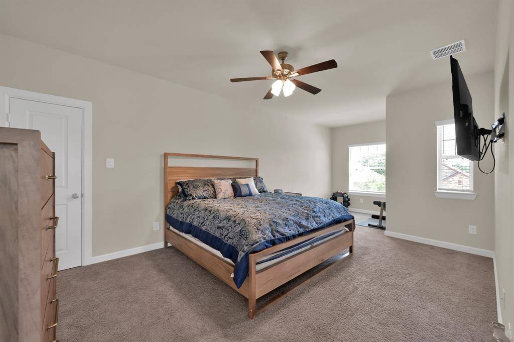 Bedroom 3 also faces the front of the home and includes an extended space perfect for a small workout space or study desk. This is the largest room upstairs.