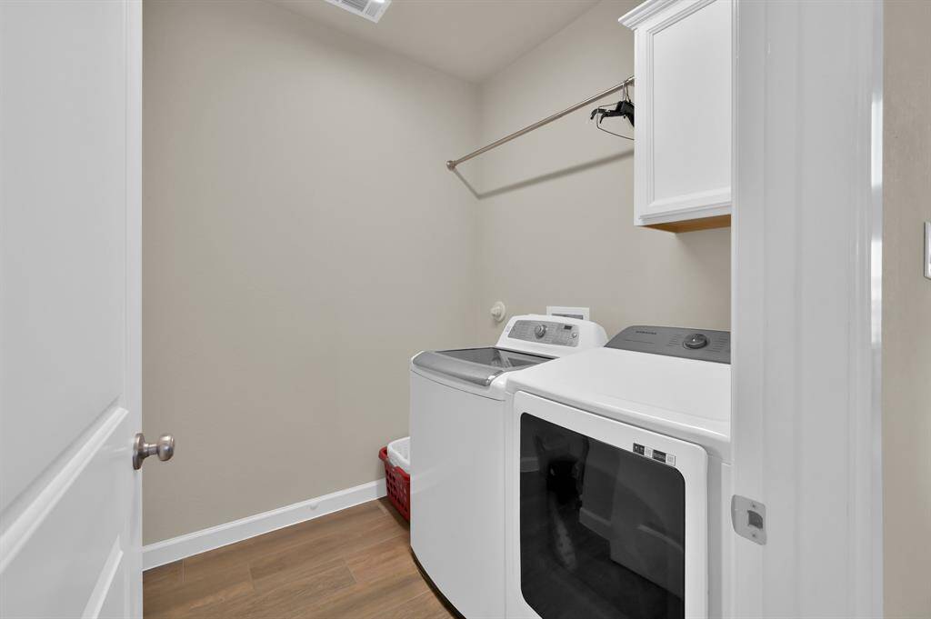 Laundry room, with extra storage nook to the left (not pictured). Immediately outside of the laundry room is a built in MUD area as well.