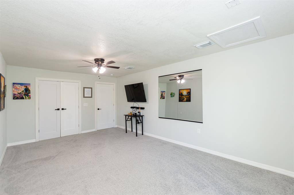 Expansive third secondary bedroom located next to the living area, featuring a walk-in closet—perfectly suited for a guest bedroom or media room.