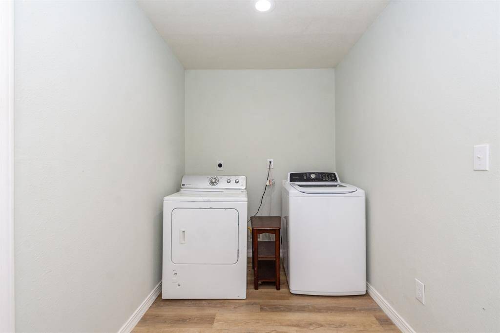 Spacious laundry room located just off the garage, offering plenty of room for built-in storage or custom organization solutions.