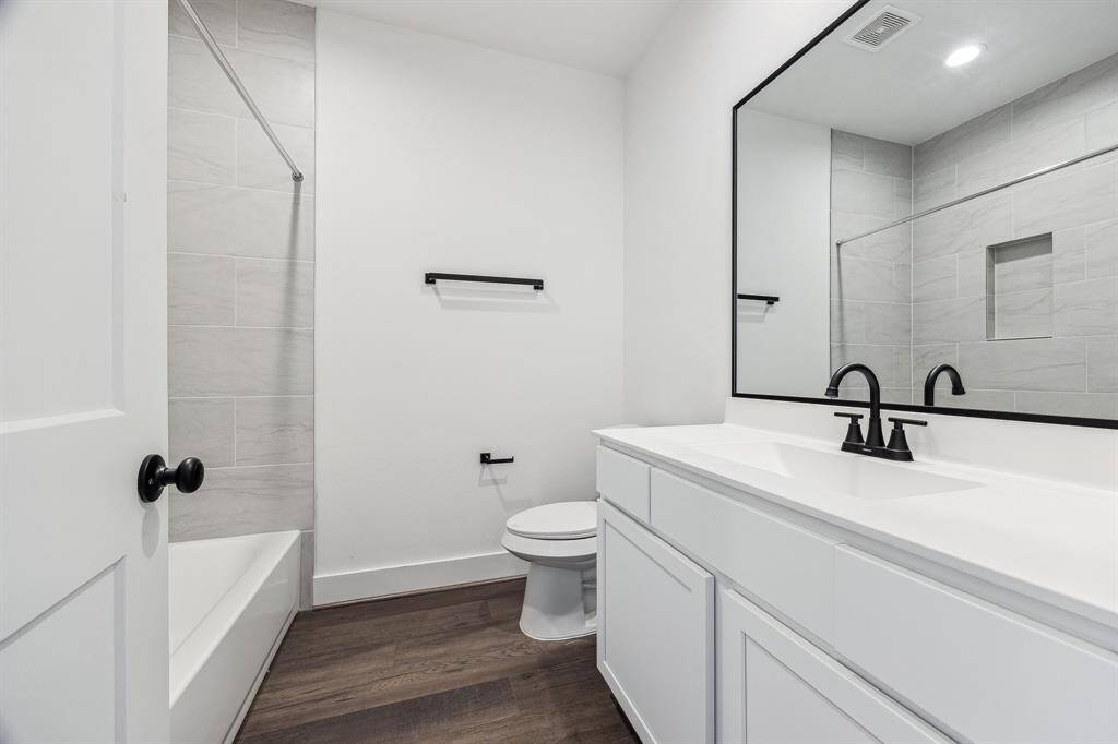 Primary bedroom with access to your own private balcony. Small seating area adjacent. This room is staged from another home.