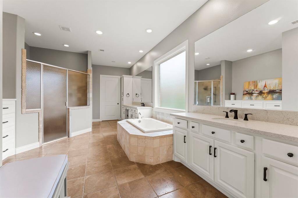 Primary Suite with plantation shutters and updated interior paint